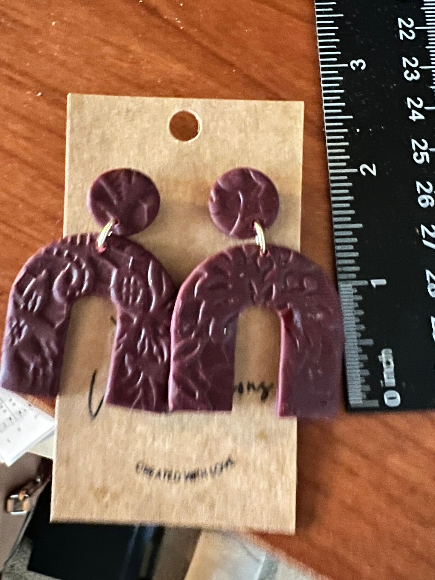 Burgundy lightweight dangling clay earrings in arch shape handmade lightweight textured dark red maroon The Archie