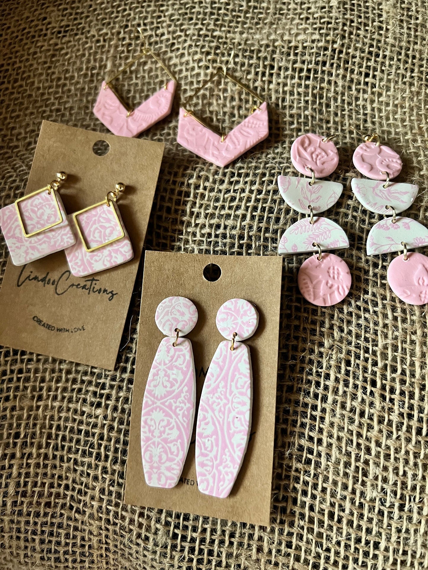 Pink textured dangling handmade clay earrings Lightweight delicate lace texture modern geometric gold hardware The Nikki