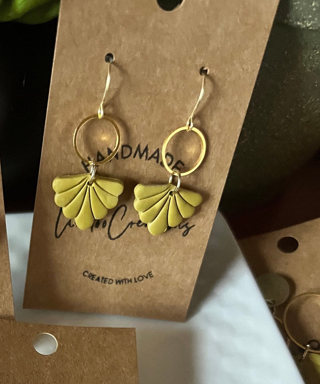 Apple Green small shell shape petite dangling clay earrings gold hardware lightweight The Leighann