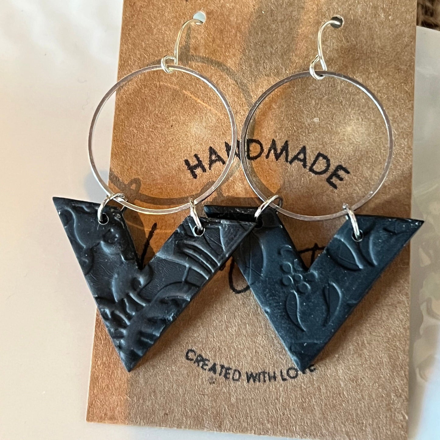 Ebony Black lightweight textured clay earrings handmade modern angle silver circle The Arrow