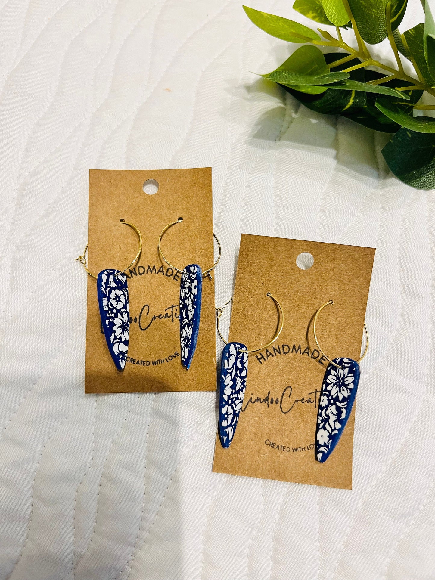 Royal Blue and white flowers dangling painted clay earring handmade lightweight floral The Dagger