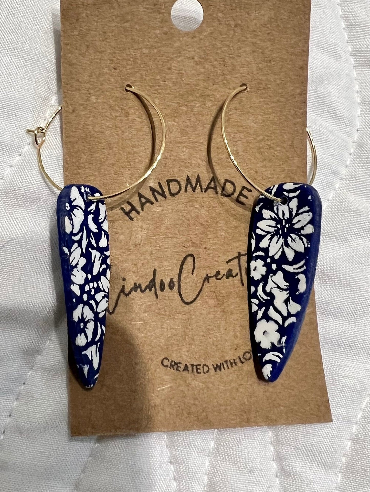 Royal Blue and white flowers dangling painted clay earring handmade lightweight floral The Dagger