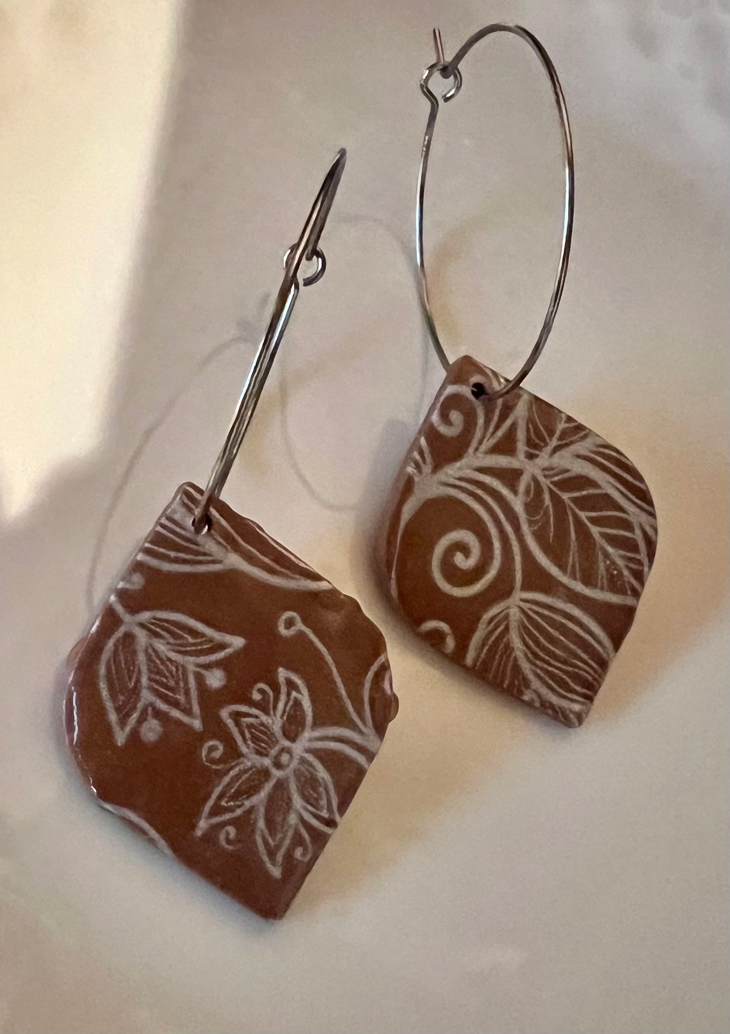 Brown tan silver dangling painted clay earrings handmade lightweight shiny resin coating ear wire closure The Claire