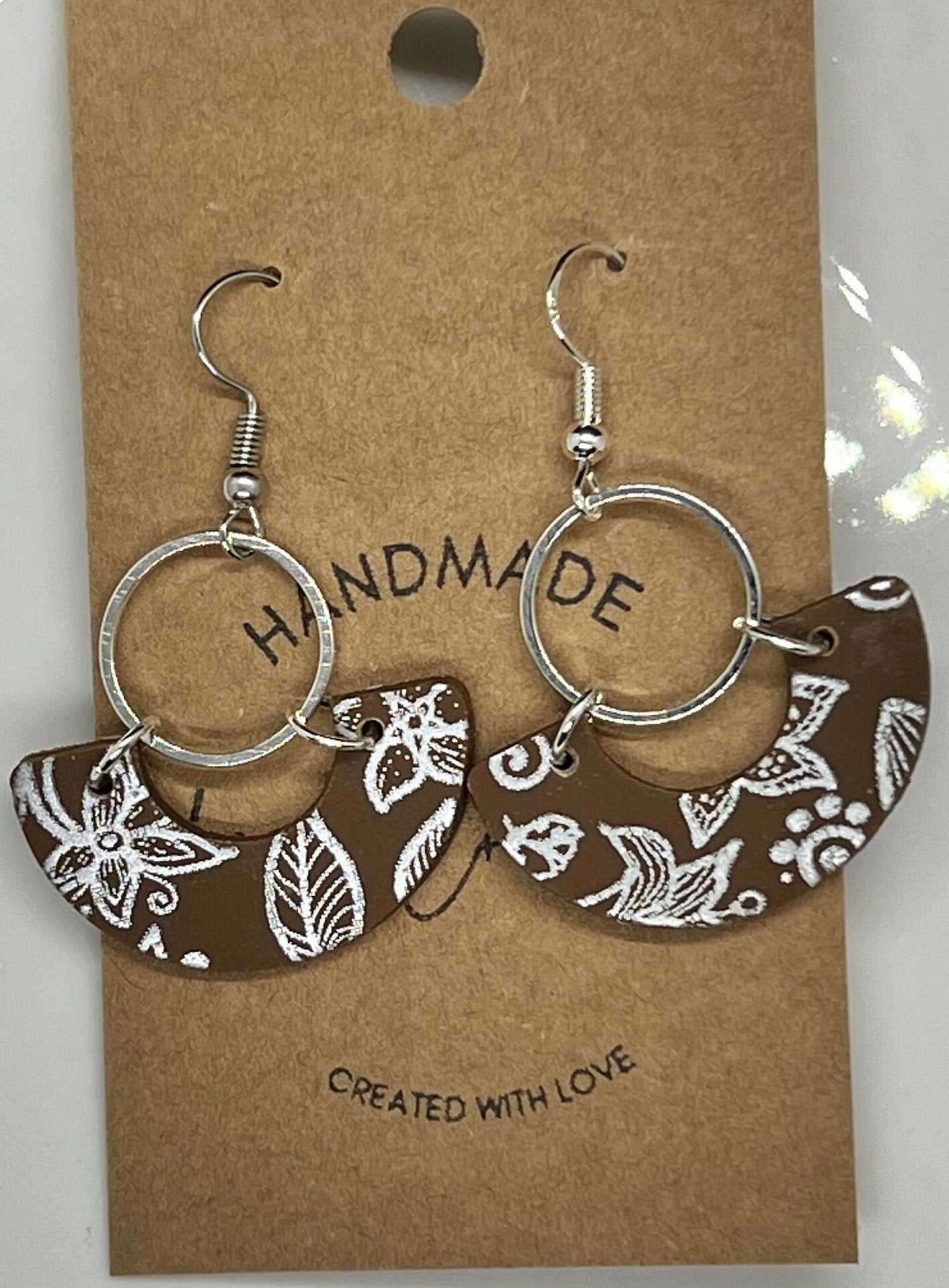 Silver and brown arch lightweight handmade clay earrings long dangling silver circle silver coated ear wire The Wendy
