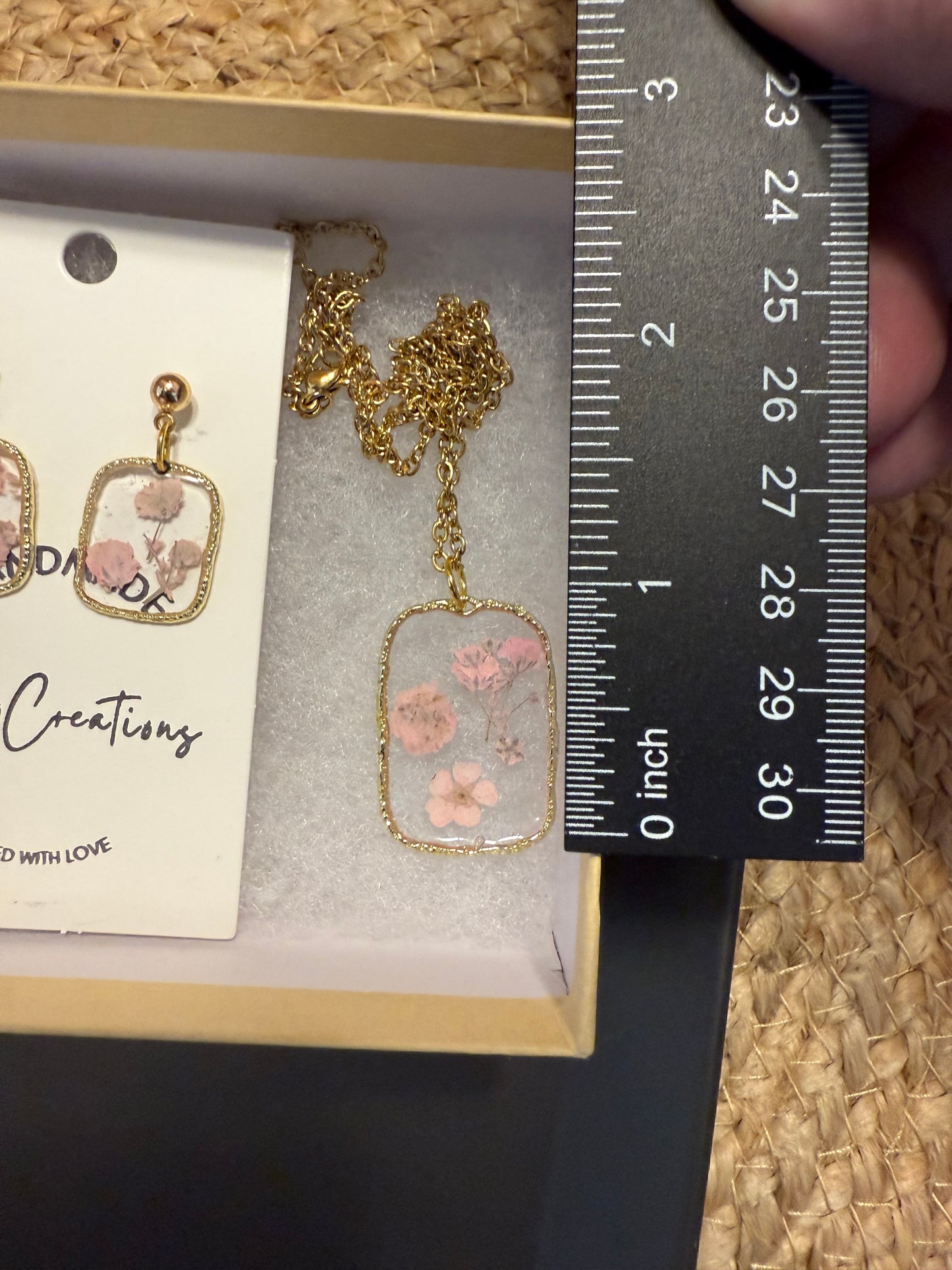 Delicate pink flowers in resin necklace and earrings set