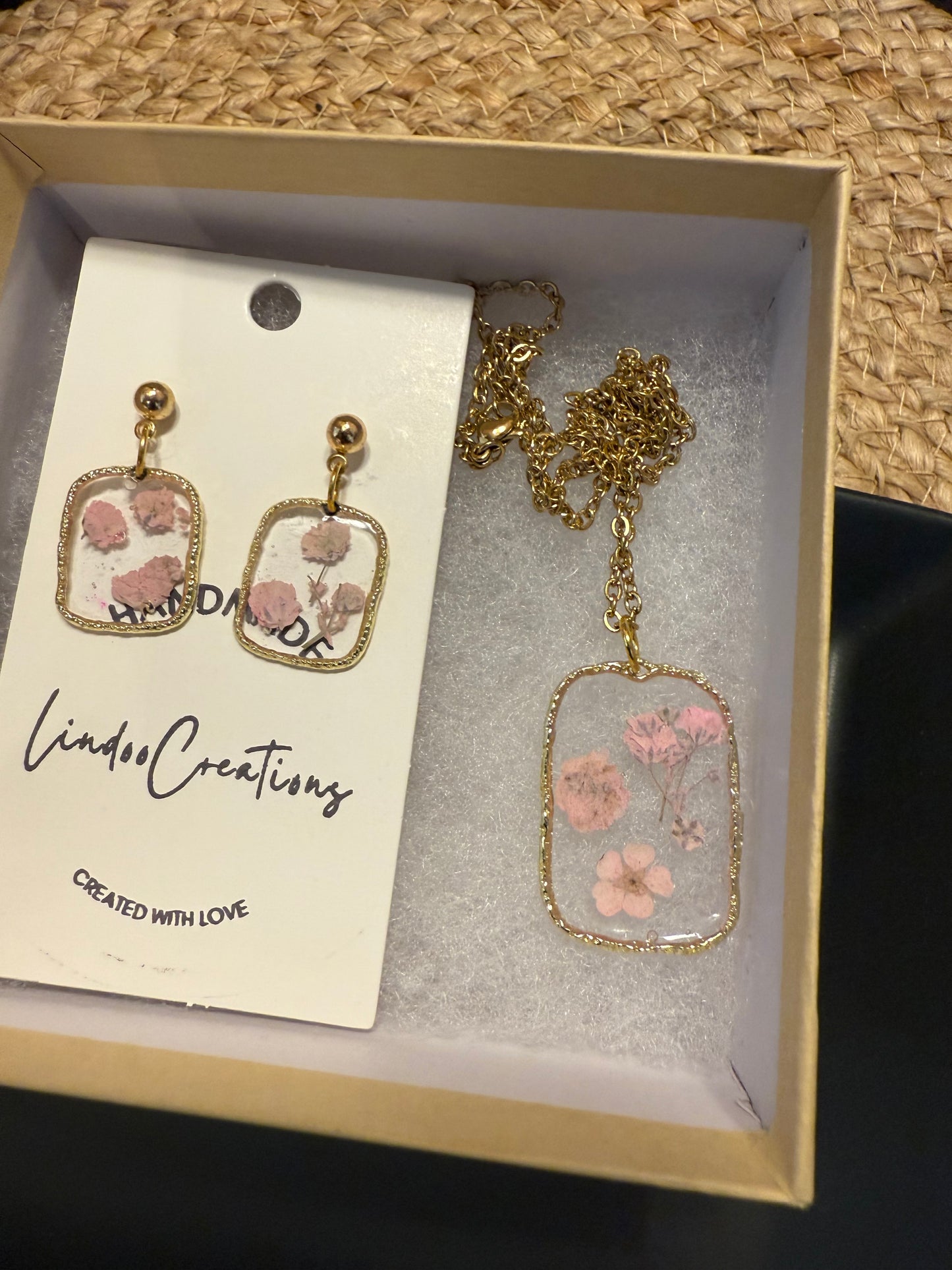 Delicate pink flowers in resin necklace and earrings set