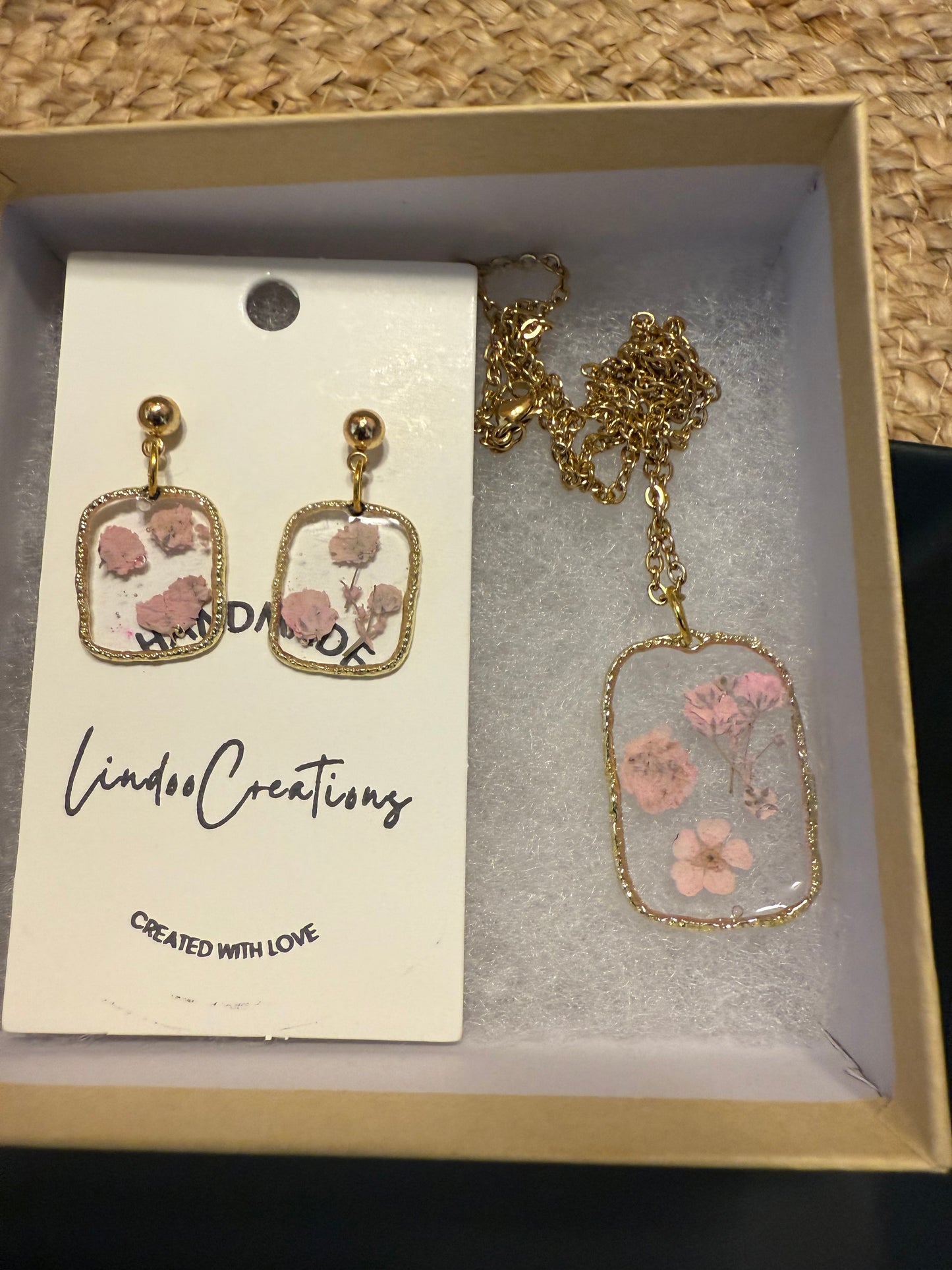 Delicate pink flowers in resin necklace and earrings set